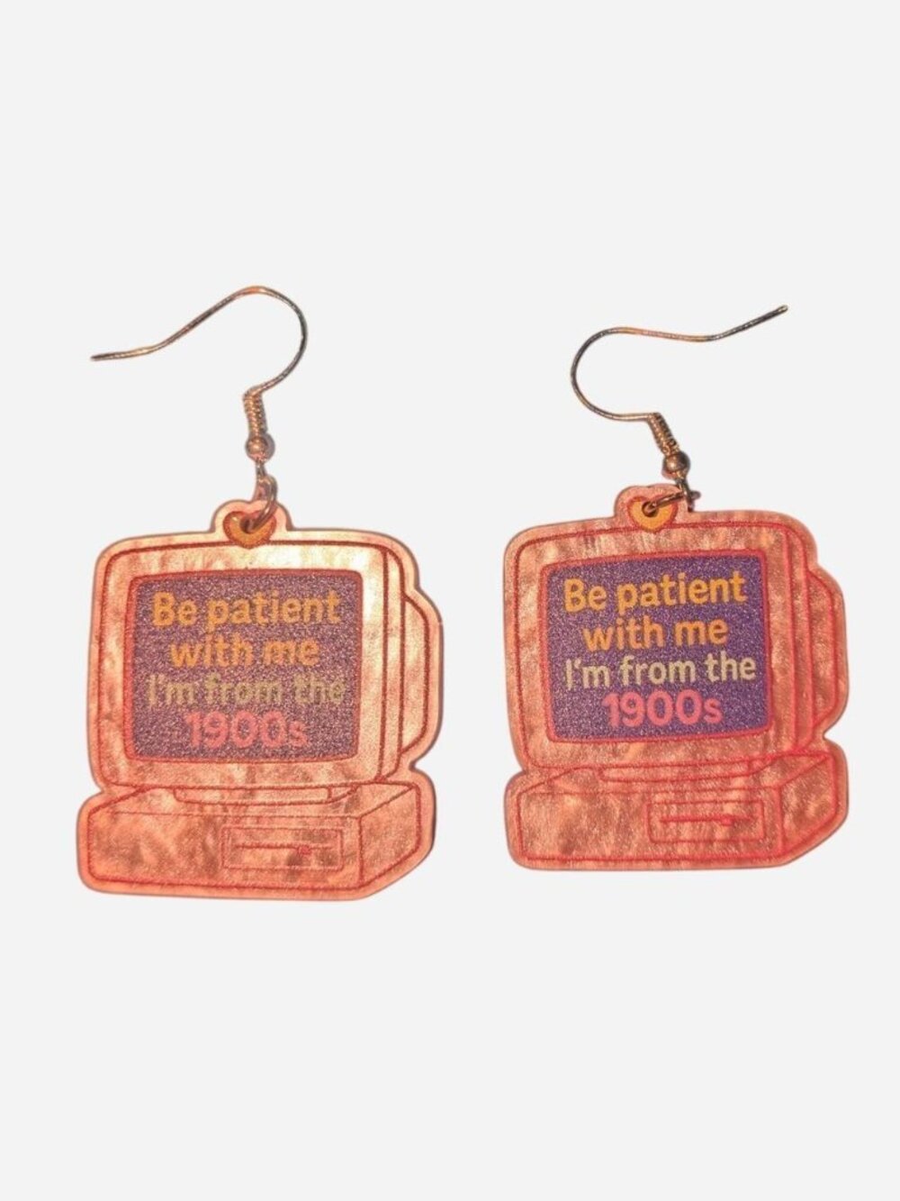 Pink vintage computer earrings with the words